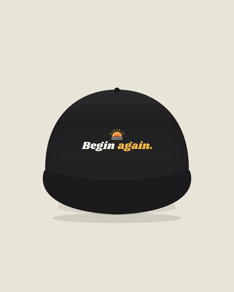 Black trucker hat with the print “Begin again.”, front view (illustration)