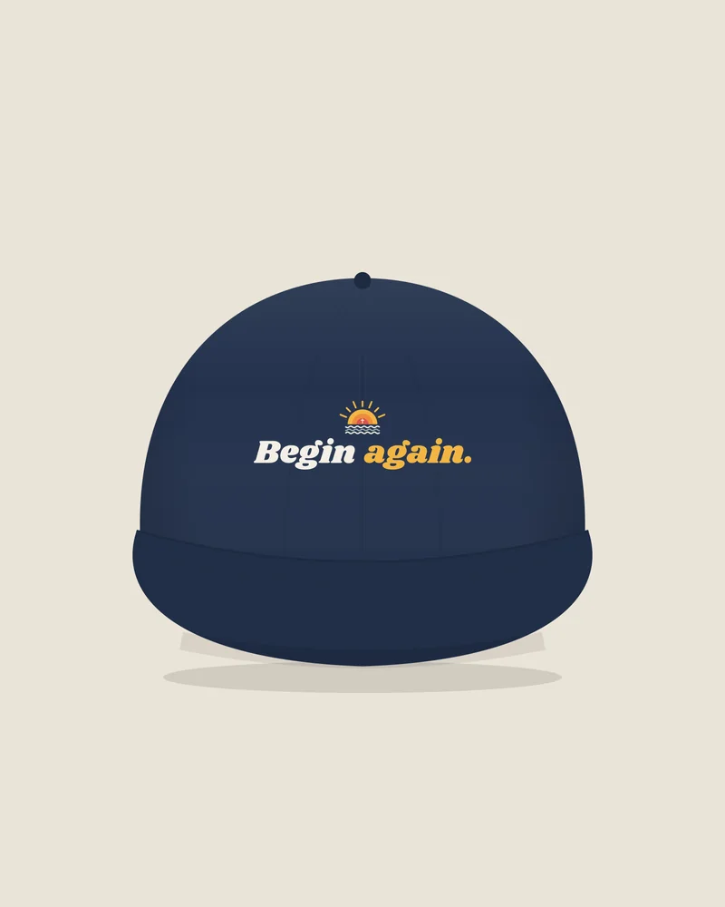 Navy trucker hat with the print “Begin again.”, front view (illustration)