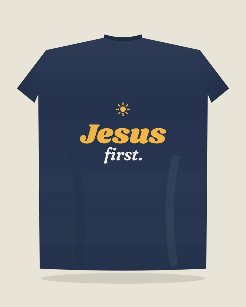 Navy tee with the print “Jesus first.”, back view (illustration)