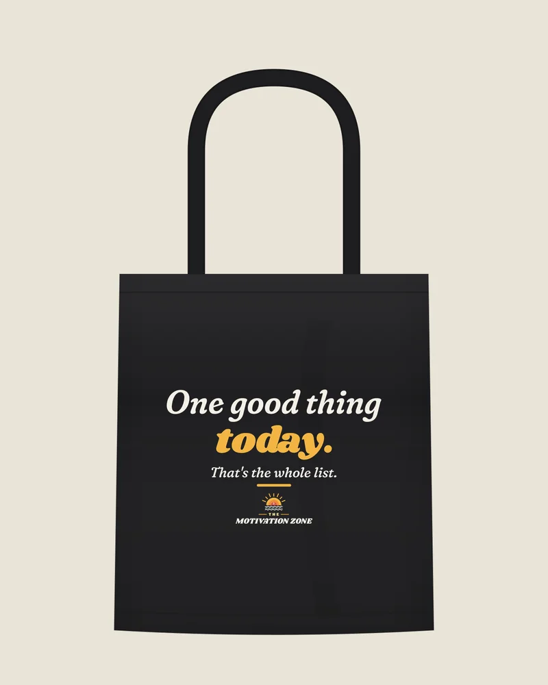 Black tote bag with the print “One good thing today.”, front view (illustration)
